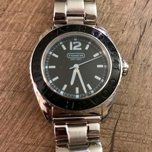 Coach women’s watch never used. Needs battery.